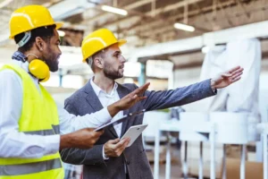 Workers in protective gear highlighting OSHA workplace safety 2025